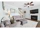 Inviting living room with fireplace, ceiling fan, comfortable seating, and a staircase at 428 Cabrill Dr, Charleston, SC 29414