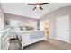 Bright main bedroom features neutral carpet, vaulted ceilings, ceiling fan and attached ensuite bath at 428 Cabrill Dr, Charleston, SC 29414
