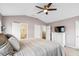 The main bedroom boasts a view of the ensuite bathroom and closets, neutral walls, and a ceiling fan at 428 Cabrill Dr, Charleston, SC 29414