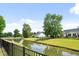 Scenic pond view with lush greenery and charming reflections, enhancing the neighborhood's appeal at 428 Cabrill Dr, Charleston, SC 29414