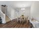 Open concept dining area adjoining a large living area with decorative lighting at 432 Doane Way, Wando, SC 29492