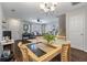 Open concept dining area adjoining a large living area with decorative lighting at 432 Doane Way, Wando, SC 29492