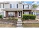 Charming brick and siding townhome featuring a cozy front porch and manicured landscaping at 432 Doane Way, Wando, SC 29492