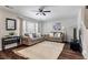 Inviting living room with plush sofas, a ceiling fan, and large window for natural light at 432 Doane Way, Wando, SC 29492