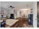 Open-concept living area with hardwood floors, staircase, and a view of the dining area at 432 Doane Way, Wando, SC 29492