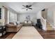 Inviting living room with plush sofas, a ceiling fan, and large window for natural light at 432 Doane Way, Wando, SC 29492