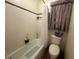 Bathroom featuring a combined tub and shower, white tiled walls, and modern fixtures at 4462 Hardwood St, Ladson, SC 29456