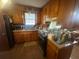 Cozy kitchen with wood cabinets, laminate countertops, and a stainless-steel appliance suite at 4462 Hardwood St, Ladson, SC 29456