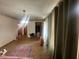 Living room featuring tile floors, neutral-toned walls, and large window coverings at 4462 Hardwood St, Ladson, SC 29456