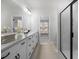 Modern bathroom with a double sink vanity, sleek mirrors, and a glass-enclosed shower for a spa-like experience at 459 White Magnolia St, Moncks Corner, SC 29461