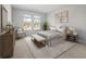 Serene bedroom with large windows, neutral decor, and plush carpet for a cozy atmosphere at 459 White Magnolia St, Moncks Corner, SC 29461