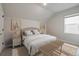 Staged bedroom with neutral walls, carpet, furniture, window and decor at 459 White Magnolia St, Moncks Corner, SC 29461