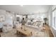 Spacious living room with hardwood floors, natural lighting, and an open layout flowing into the kitchen at 459 White Magnolia St, Moncks Corner, SC 29461