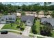 Traditional home with mature landscaping, a driveway, and a beautiful lawn with trees at 465 Blue Dragonfly Dr, Charleston, SC 29414
