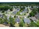 Stunning aerial view of a residential neighborhood showcasing well-manicured lawns and tree-lined streets at 465 Blue Dragonfly Dr, Charleston, SC 29414