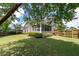 Inviting backyard with lush green lawn and screened porch, perfect for outdoor enjoyment at 465 Blue Dragonfly Dr, Charleston, SC 29414