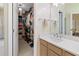 Well-lit bathroom showcasing a spacious walk-in closet with ample storage and vanity at 465 Blue Dragonfly Dr, Charleston, SC 29414