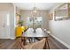 Bright dining room with a large window, hardwood floors, and contemporary furnishings at 465 Blue Dragonfly Dr, Charleston, SC 29414