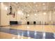 Spacious gymnasium featuring basketball hoops, bleachers, and ample space for sports at 465 Blue Dragonfly Dr, Charleston, SC 29414