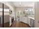 Modern kitchen featuring white cabinets, stainless steel appliances, and sleek countertops at 465 Blue Dragonfly Dr, Charleston, SC 29414