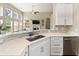 Well-lit kitchen with stainless steel appliances, a breakfast bar, and updated fixtures at 465 Blue Dragonfly Dr, Charleston, SC 29414
