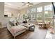 Spacious living room with high ceilings, large windows, and comfortable seating at 465 Blue Dragonfly Dr, Charleston, SC 29414