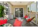 Enclosed porch space with patio furniture, ceiling fan, sliding glass doors and lattice work at 465 Blue Dragonfly Dr, Charleston, SC 29414