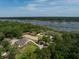 Stunning aerial view of the horse farm and home nestled along the water at 4855 Retriever Rd, Wadmalaw Island, SC 29487