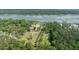 Expansive horse farm with a residence nestled amidst lush greenery near the waterfront at 4855 Retriever Rd, Wadmalaw Island, SC 29487