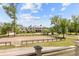 Stunning home with riding ring, perfectly manicured grounds, and beautiful trees under a bright blue, partly cloudy sky at 4855 Retriever Rd, Wadmalaw Island, SC 29487