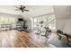 Home gym with hardwood floors, multiple windows, and a variety of exercise equipment at 4855 Retriever Rd, Wadmalaw Island, SC 29487