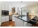 Bright kitchen with stainless steel appliances, butcher block backsplash and breakfast bar with seating at 4855 Retriever Rd, Wadmalaw Island, SC 29487