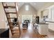 Open floor plan featuring a kitchen, living and dining space, high ceiling and hardwood floors at 4855 Retriever Rd, Wadmalaw Island, SC 29487