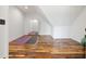 Studio with slanted ceilings, hardwood floors, and a large mirror at 4855 Retriever Rd, Wadmalaw Island, SC 29487