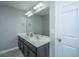 Bathroom with double vanity, large mirror, and decorative lighting at 493 Nelliefield Trl, Wando, SC 29492