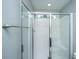 Modern bathroom featuring a bright white shower with clear glass doors and chrome fixtures at 493 Nelliefield Trl, Wando, SC 29492