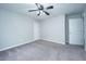 Bedroom with neutral carpet, ceiling fan, and two closets at 493 Nelliefield Trl, Wando, SC 29492