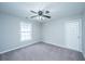 Cozy carpeted bedroom featuring a ceiling fan and a window for natural light at 493 Nelliefield Trl, Wando, SC 29492