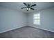 Bright, carpeted bedroom with a ceiling fan and a window for natural light at 493 Nelliefield Trl, Wando, SC 29492