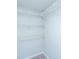 Walk-in closet with carpet and white, coated wire shelving units ready to organize your wardrobe at 493 Nelliefield Trl, Wando, SC 29492