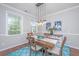 Charming dining area with stylish decor and modern pendant lighting at 493 Nelliefield Trl, Wando, SC 29492