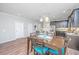 Open floor plan with dining area leading to the kitchen, featuring stainless steel appliances at 493 Nelliefield Trl, Wando, SC 29492