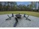 Cozy fire pit area with seating offers a perfect spot for evening gatherings and relaxation at 493 Nelliefield Trl, Wando, SC 29492