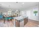 Bright kitchen island overlooking the living and dining areas at 493 Nelliefield Trl, Wando, SC 29492