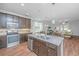 Open kitchen with modern appliances and a view into the living room at 493 Nelliefield Trl, Wando, SC 29492