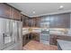 Modern kitchen with stainless steel appliances and granite countertops at 493 Nelliefield Trl, Wando, SC 29492