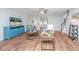 Bright and airy living room featuring a comfortable sofa and plenty of natural light at 493 Nelliefield Trl, Wando, SC 29492
