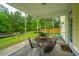 Inviting screened porch with a view of the fenced backyard, offering a serene outdoor space at 493 Nelliefield Trl, Wando, SC 29492