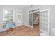 Bright sunroom with French doors and plenty of natural light, perfect for relaxing or working from home at 493 Nelliefield Trl, Wando, SC 29492