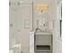 The bathroom has a stylish vanity with a marble counter, and a walk-in shower with glass doors at 5 Smith St, Charleston, SC 29401